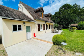 House in a green setting with swimming pool